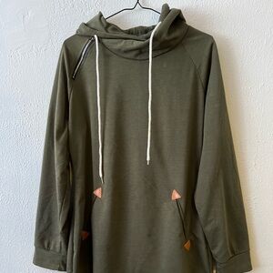 It is a green dress coat with pockets and a hood. Very soft and new.